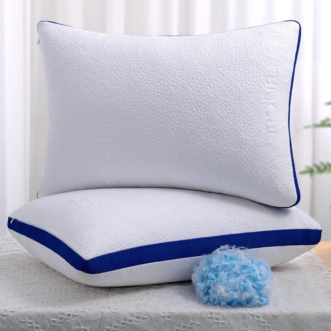 A pair of white pillows with blue trim, featuring the OYT Cooling Bed Pillows for a refreshing and cozy night's rest.