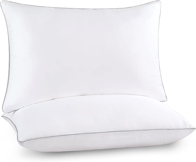 Two soft pillows on a white background, showcasing the Pozino two-pack cooling Pillow Set for comfort and relaxation.