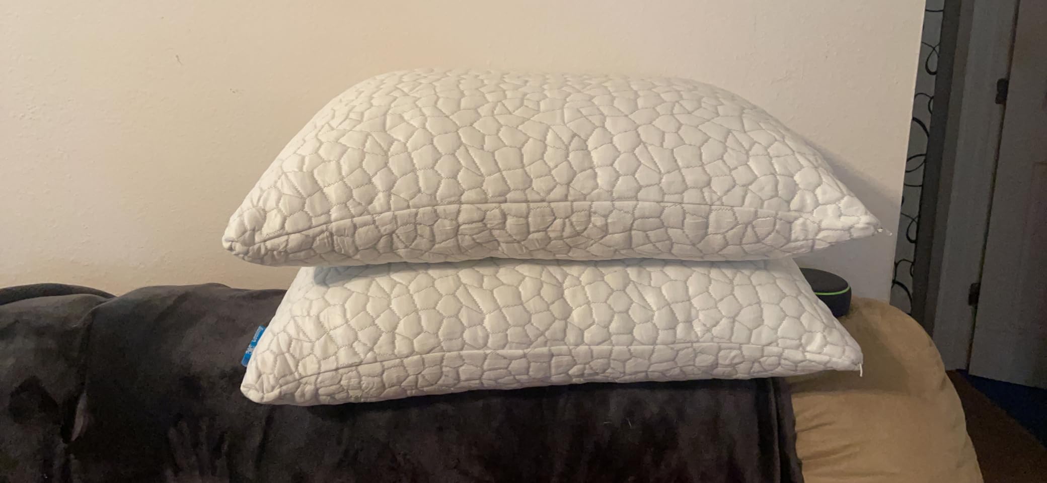 Two white pillows stacked on a dark blanket show the QUTOOL Cooling Pillow for Sleeping 2 Pack Queen size in use for a product review and featured in the 10 Most Recommended Pillows.