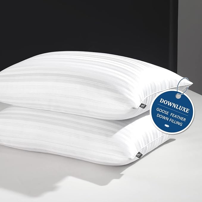 Two Downluxe Goose Down Pillows with a tag attached, showcasing their soft and comfortable design.