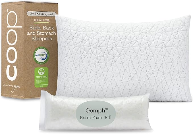 The Coop Home Goods Bed Pillows are displayed beside a box, showcasing their comfortable design and packaging.